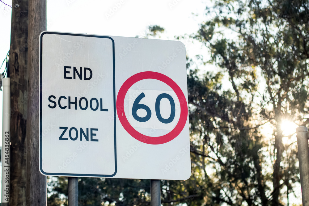 End school zone road sign with speed limit 60 in Australia. Road safety