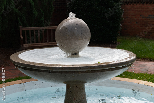 Outdoors  sphere shaped fountain with gentle flowing water photo