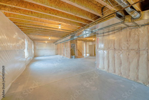 Large unfinished basement with woodframes and wall insulation photo