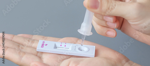 man swab COVID-19 testing by Rapid Antigen Test kit. Coronavirus Self nasal or Home test  Lockdown and Home Isolation concept