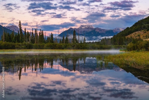 Fototapeta Naklejka Na Ścianę i Meble -  Cloudy Sunrise Reflecting On Vermilion Lakes