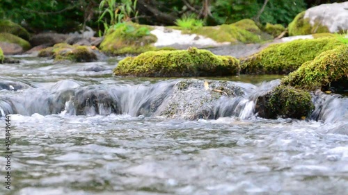 in summer rocky mountain river water silk. mountain river.