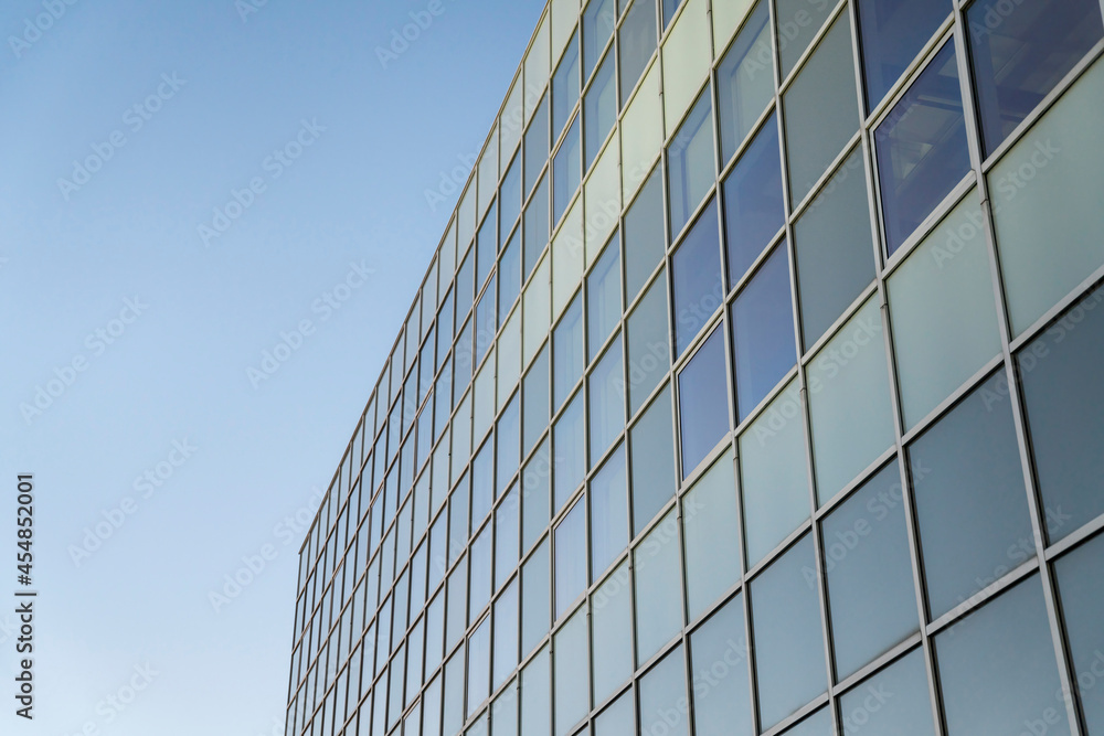 Facade of a glass building against the clear blue sky background at Tacoma, Washington