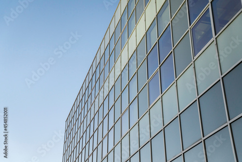 Facade of a glass building against the clear blue sky background at Tacoma, Washington