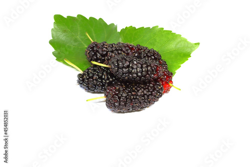 five organic Mulberry fruits with green leaves isolated on white background.