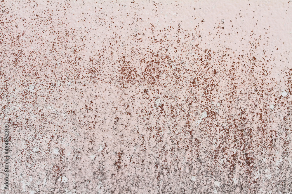The pink and black background plaster walls are old and dirty The pink and black background plaster walls are old and dirty