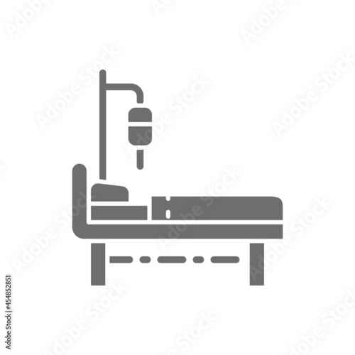 Hospital bed with medical equipments, intensive care, resuscitation grey icon.