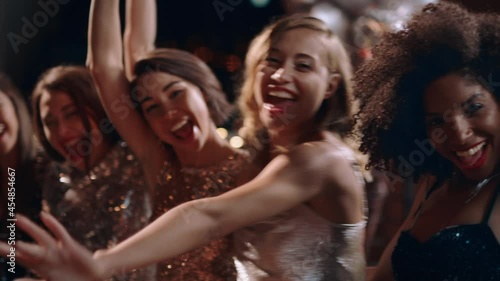 beautiful group of women celebrating glamorous party having fun enjoying extravagant nightlife together wearing gorgeous fashion on rooftop 4k footage