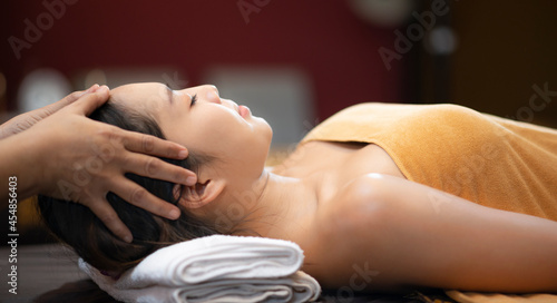 Beautiful Young Asian Woman in spa salon