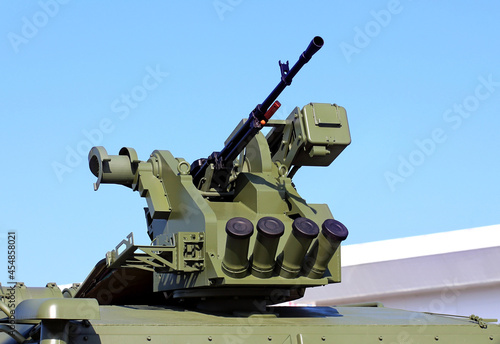 Machine gun on the on the roof of an army vehicle