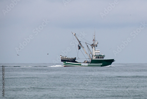 Small fishing trawler in between Santa Barbara and Ventura harbor on the central coast of California United States