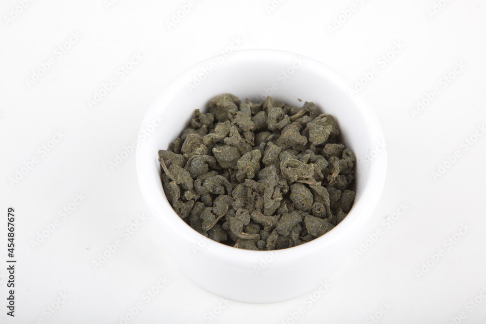tea leaves for brewing in a white cup tea leaves for brewing in a white cup