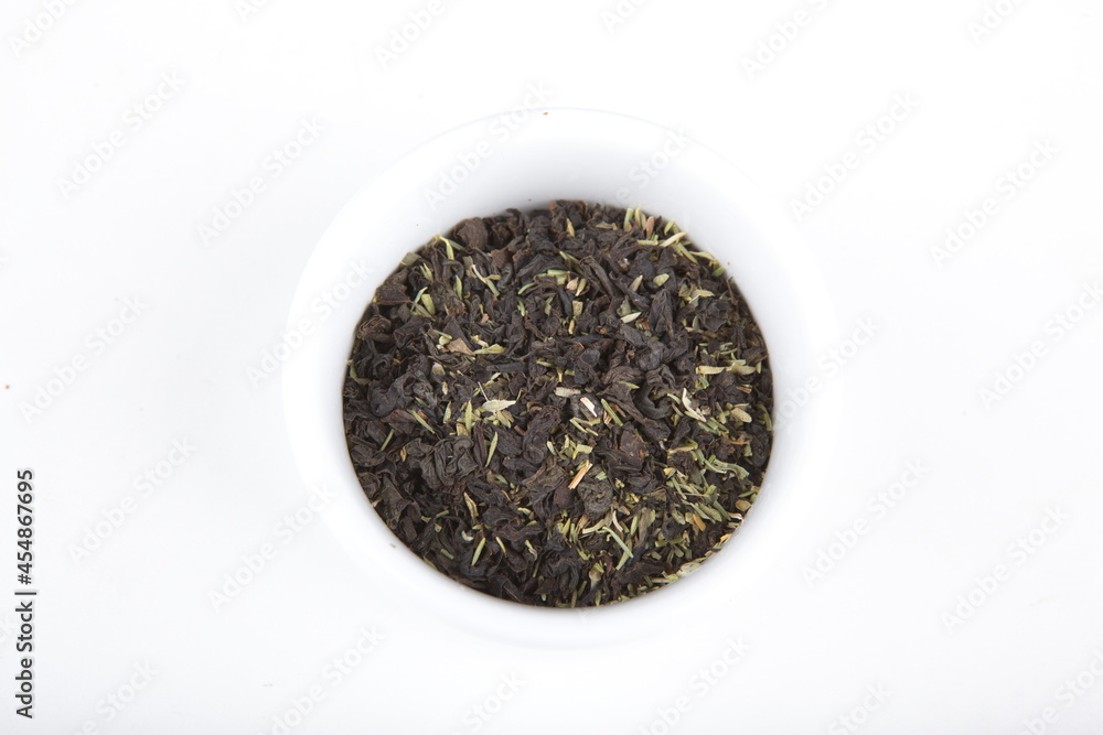 tea leaves for brewing in a white cup tea leaves for brewing in a white cup