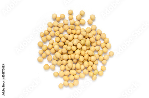 Closed up dry organic soybean seed pile on white background