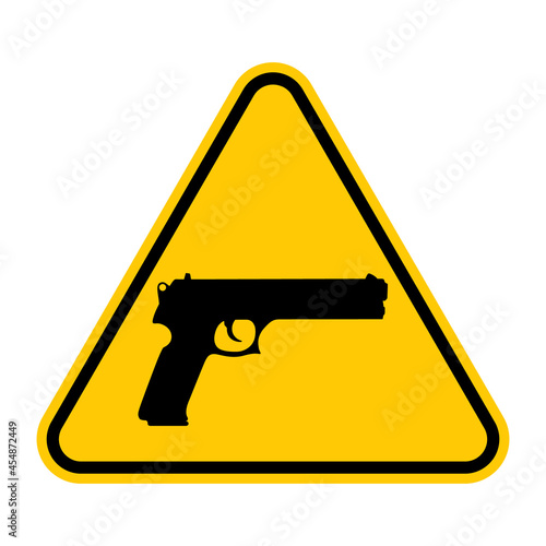 Guns warning sign. Vector illustration of yellow triangle sign with pistol icon inside. Gun zone pictogram. Caution weapons. Firearms welcome.