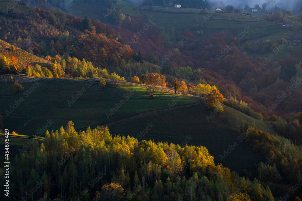 Moody autumn landscape in a rural Transylvanian village.