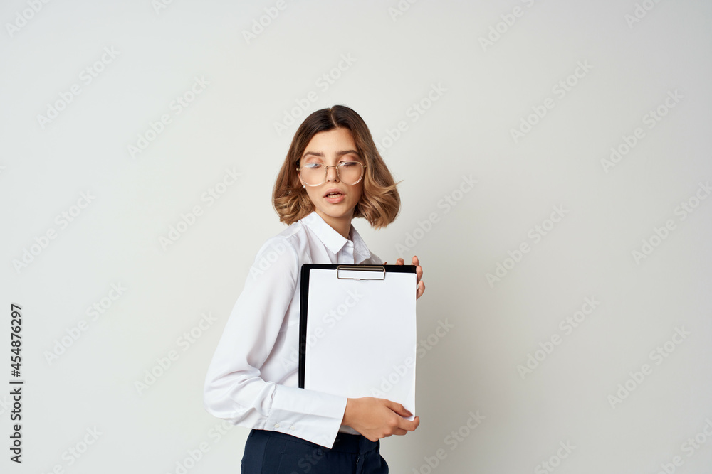 Business woman in white shirt documents office manager Business woman in white shirt documents office manager
