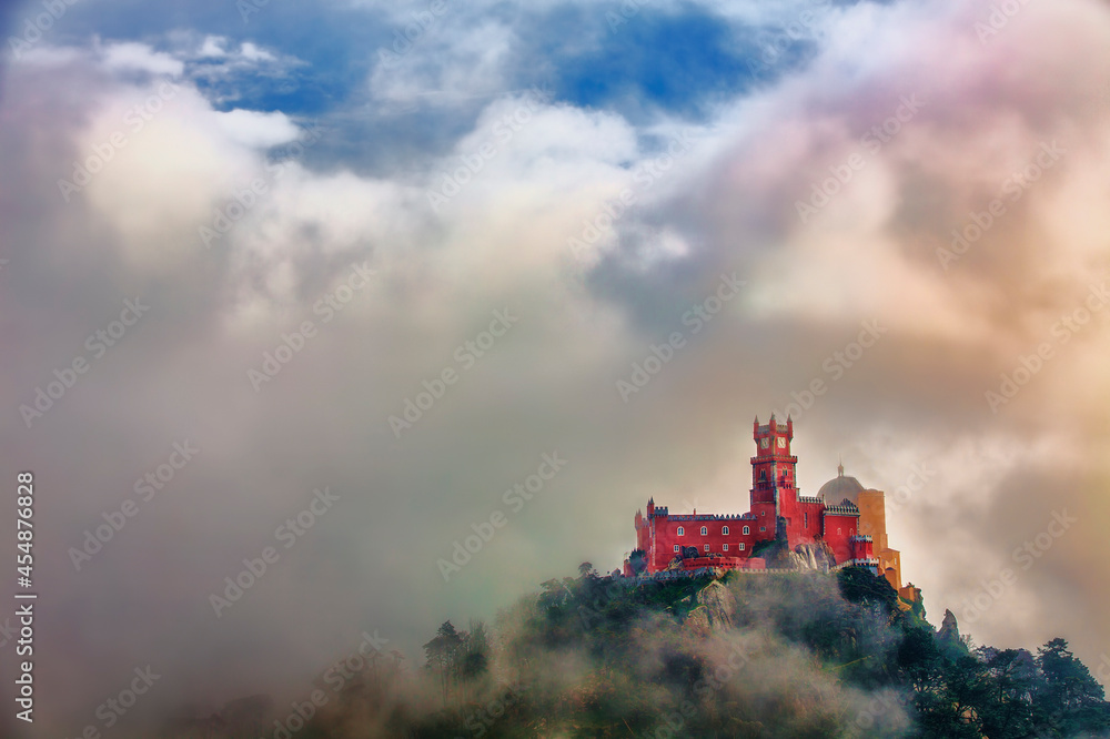Fototapeta premium Pena National Palace, Sintra, Portugal, Partly Covered in Afternoon Fog after Rain