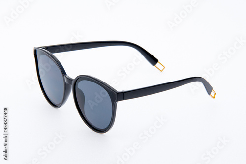 Fashion sunglasses black frames on white background.