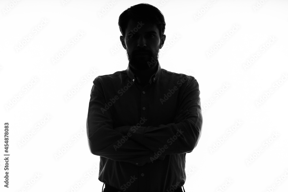 The man in a suit gun in the hands of the emotions silhouette isolated background The man in a suit gun in the hands of the emotions silhouette isolated background