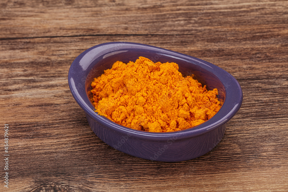 Tumeric powder in the bowl Tumeric powder in the bowl