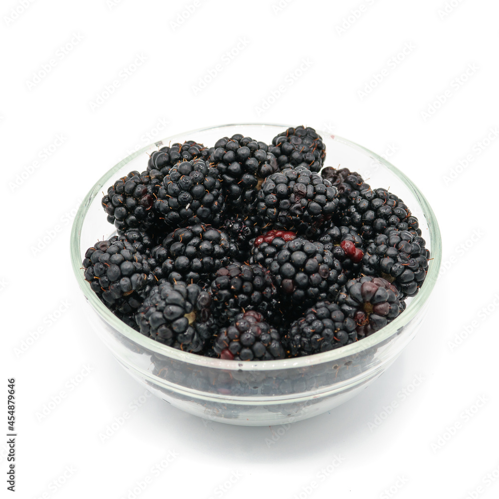 fresh blackberries in a bowl from the home garden on a white background fresh blackberries in a bowl from the home garden on a white background