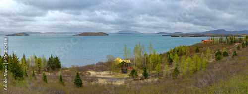 Summer cottages by Thingvallavatn lake in Iceland.