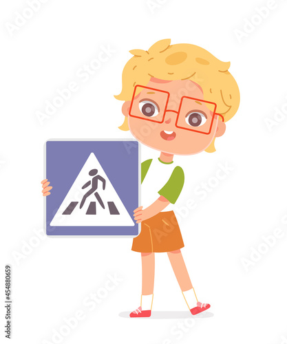 Blonde boy with short hair and curly hair wearing glasses, light green skirt and jacket studying traffic rules, holding sign in front of pedestrian crossing