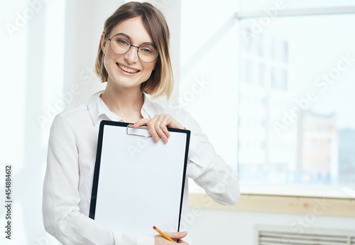 Business woman in glasses in white shirt documents Copy Space