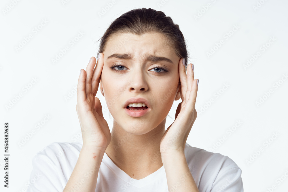 disgruntled woman in white t-shirt joint pain health problems emotions disgruntled woman in white t-shirt joint pain health problems emotions