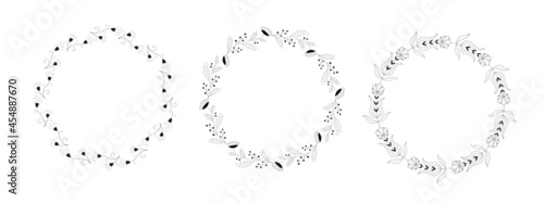 Set of vector wreaths in black ink on a white background. Flowers and herbs are hand drawn. Natural plants from сhamomile, aster. Botany and flora. Round design for medicine, postcards, cosmetics.