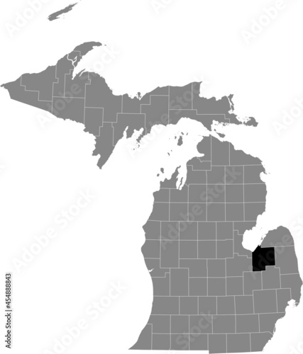 Black highlighted location map of the Tuscola County inside gray map of the Federal State of Michigan, USA photo