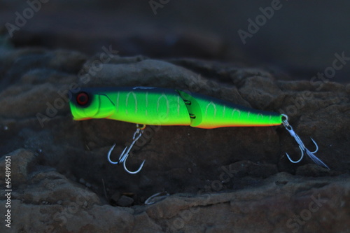 Fishing lure walker on stone background