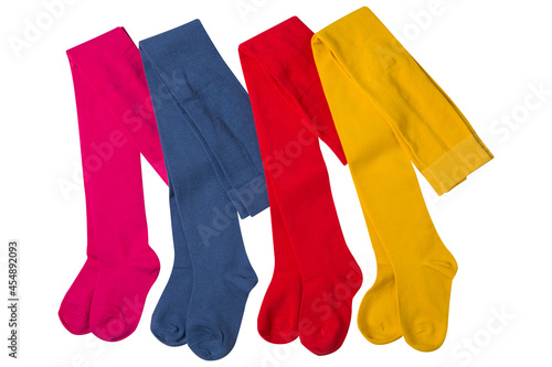 four children's multi-colored tights folded in half, lie in a row, on a white background