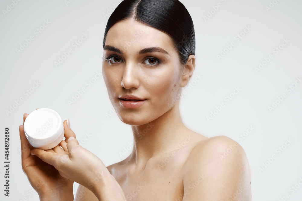 cheerful brunette bathhouse with cream skin care cheerful brunette bathhouse with cream skin care