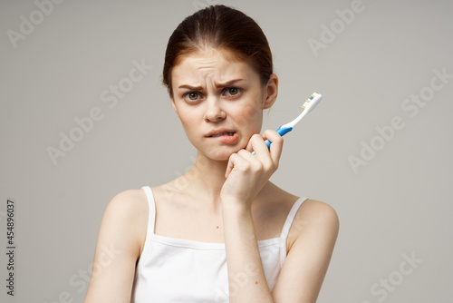 cheerful woman in white t-shirt dental hygiene health care studio lifestyle