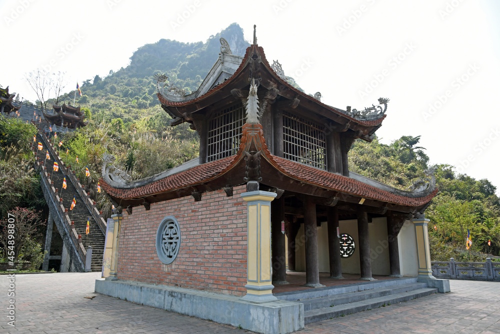 Pagoda on the territory of a Buddhist temple against the backdrop of mountains on a cloudy day Pagoda on the territory of a Buddhist temple against the backdrop of mountains on a cloudy day