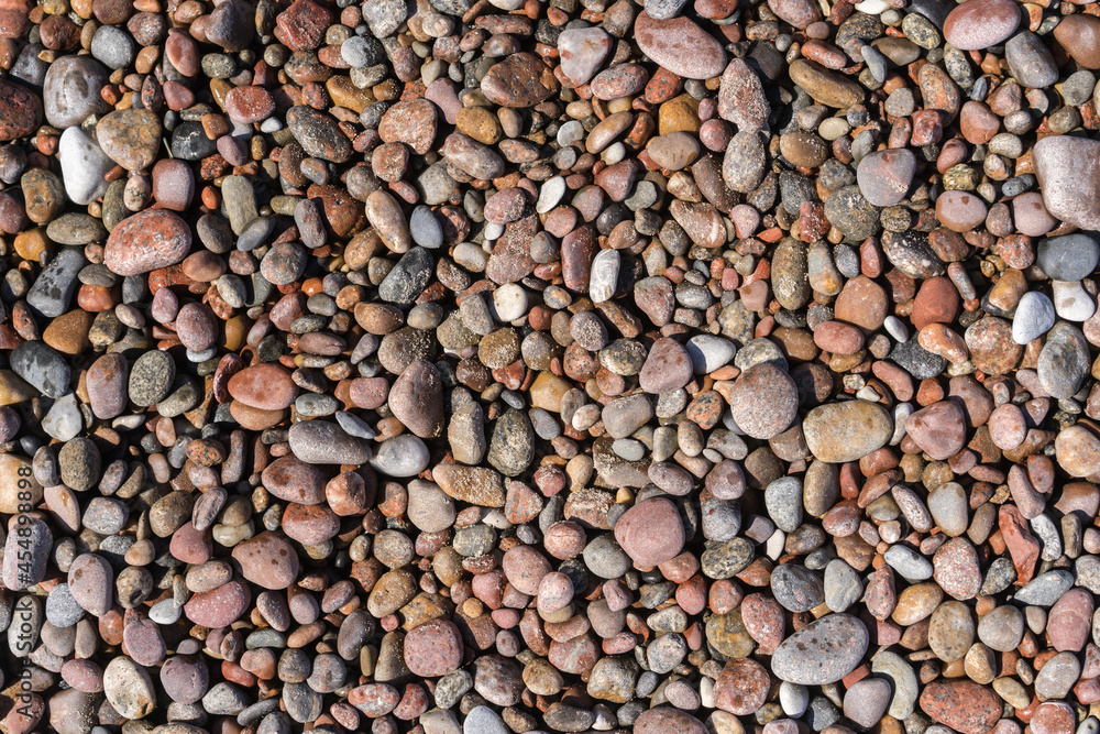 Smooth round pebbles texture background. Pebble sea beach close-up, dark wet pebble and gray dry pebble. High quality photo Smooth round pebbles texture background. Pebble sea beach close-up, dark wet pebble and gray dry pebble. High quality photo
