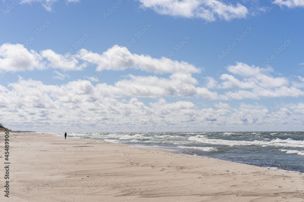 Coast of the Baltic Sea. Sand dunes with clouds. Typical Baltic beach landscape.