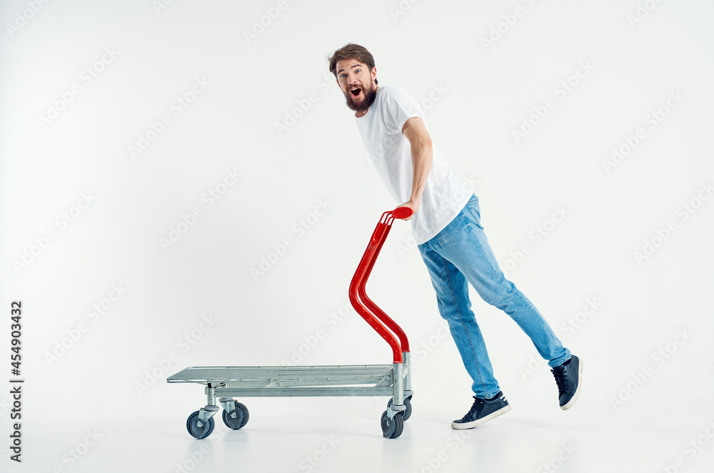 Cheerful man ride a cart entertainment shipping isolated background