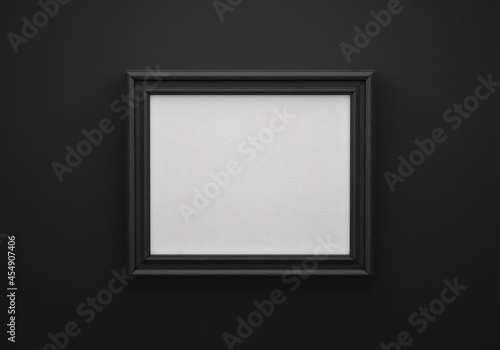 The black color picture horizontal frame on black wall with textured blank canvas, 3D mockup