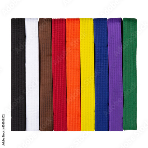 set of colored kimono belts, for karate, judo and other martial arts, on a white background