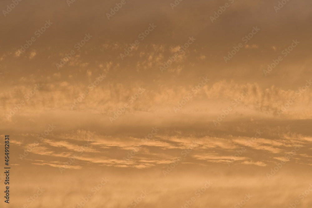 Golden sunset sky, telephoto perspective gives abstract background Golden sunset sky, telephoto perspective gives abstract background