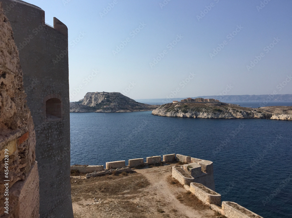 View of the Hôpital Caroline on Ratonneau island, seen from Château d’If - a fortress and former prison located on the Île d'If, the smallest island in the Frioul archipelago, next to Marseille. 