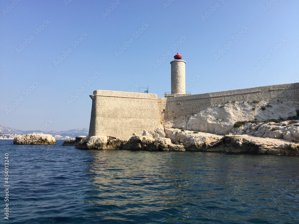 The lighthouse at Château d'If, a fortress and former prison located on the Île d'If, the smallest island in the Frioul archipelago, situated 1.5 km offshore from Marseille in southeastern France.