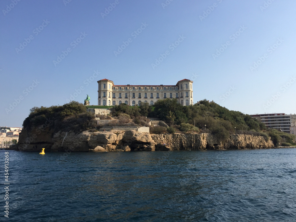 View of the Pharo Palace and its gardens in Marseille, France, as seen from the sea. The palace was built in 1858 by Emperor Napoleon III for Empress Eugénie.