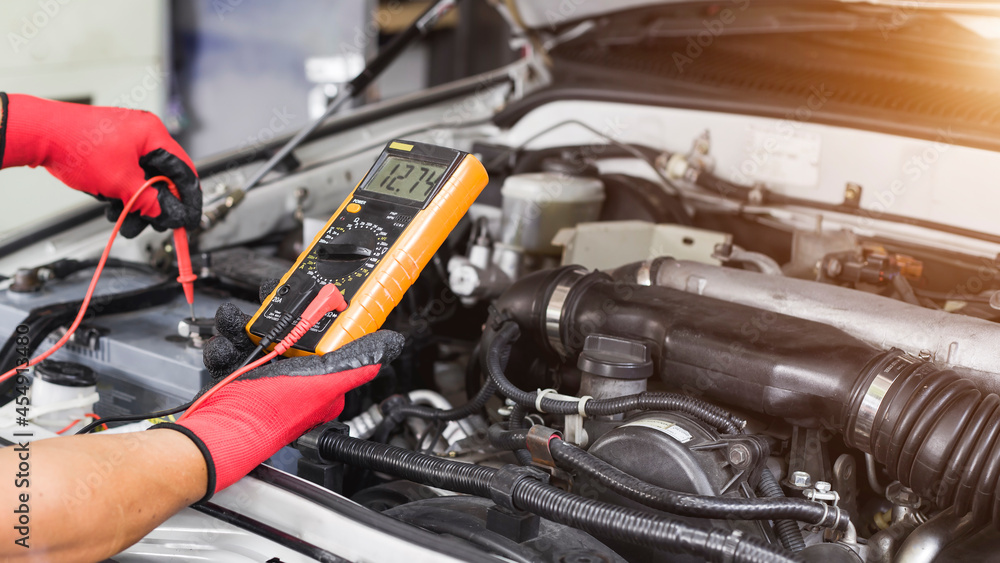 custom made wallpaper toronto digitalA technician is checking the car battery for availability.