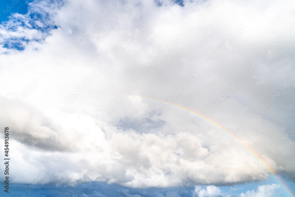 A rainbow over the sea after rain A rainbow over the sea after rain