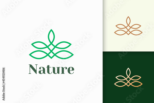Flower logo in feminine and luxury style represent health and beauty