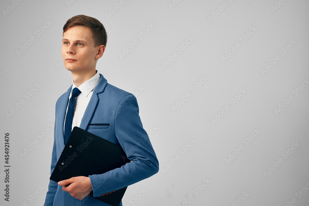 business man holding documents office professional work light background business man holding documents office professional work light background